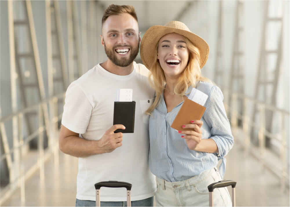 happy-couple-with-passports-and-tickets-at-airport-2021-08-30-02-08-49-utc-1.jpg